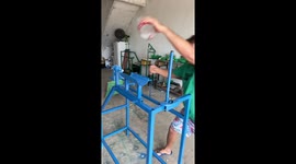 Man makes broom using recycled plastic bottles.