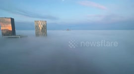 Canary Wharf skyscrapers peek through freezing fog in impressive timelapse video