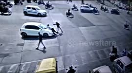 Driver with gun in car drags traffic officer on hood to escape ticket