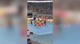 Cheerleaders pull off gravity-defying leap at basketball game