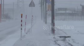 Visibility reduced as snowstorm batters northern Japan