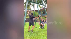 Terrified girl has hilarious reaction on loop-the-loop 360 degrees metal swing