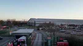 Aerial Footage - Royal Mail Strike - Quiet Leeds Mail Centre contrasted with lively picket line in West Yorkshire