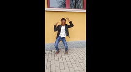Michael dancing to Afrobeats, a very popular African dance steps.