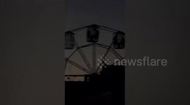 Ferris wheel power cut leaves fairgoers stuck in the air without lights