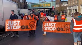 Just Stop Oil activists block Camden High Street during a slow march in London