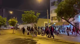 Riot police March through Lima, Peru as protests take place across the centre