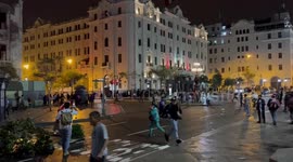 Riot police fire tear gas and charge at protesters in Lima’s Plaza San Martín