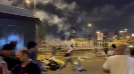 Riot police fire tear gas at people protesting in Lima, Peru