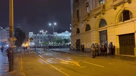 Police in tense stand-off with protesters in Lima. Loud bangs are heard as police respond