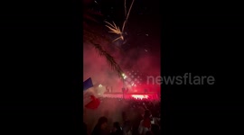 France fans celebrate victory over Morocco with fireworks