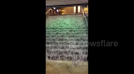 Station stairs turns into incessant waterfall in Madrid, Spain
