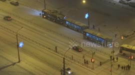 Snowfall provoked car crash during morning rush hours. People try to get away from it. St Petersburg, Russia