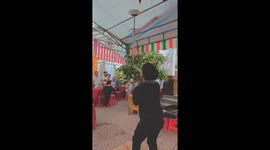 Man balancing two swords at the tip of his mouth