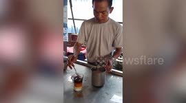 Master tea maker shows how to make Myanmar's milky marvel, four-layered Burmese tea