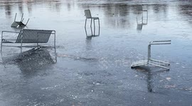 Pranksters throw park furniture onto the ice of the frozen Serpentine Lake in London's Hyde Park
