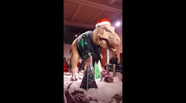 Jurassic joy: the famous t-rex at the natural history museum dons his Christmas jumper and Santa hat