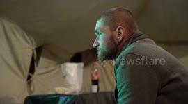 Ukrainians watch the World Cup final in a tent in devastated Kharkiv