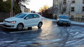Four wheel drive vehicles, trucks, cars, SUVs sliding and slipping on Ice in December. Shot on location in Kingswood, Bristol, UK.