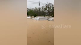 Pickup trucks submerged by flash floods amid storms in southern Thailand