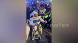Old lady dances during World Cup victory celebrations in Argentina