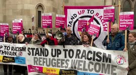 Activists speak in support of refugees outside the High Court