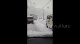 Hiroshima covered in blanket of snow as winter storm blasts Japan