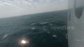Search continues for 21 missing crew after navy ship sank during storm in southern Thailand