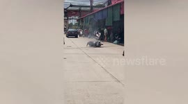 Motorcycle bursts into flames while being repaired outside shop