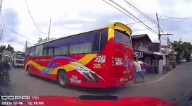 Speeding driver crashes into bus reversing across road