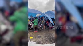Freak thunderstorm batters market stalls amid floods in southern Thailand