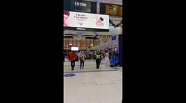 Policewoman dances with Elvis impersonator at Liverpool Street station