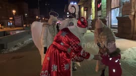 Kyiv blacked out after nighttime drone strike still sees Santa-like figure giving gifts to children