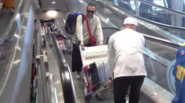 Christmas travellers at Bangkok Airport stuck with baggage on failed escalator