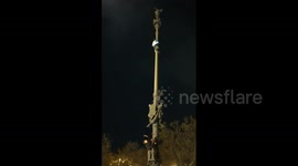 Daredevil pole climber among over 14,000 Argentine fans in Barcelona celebrating World Cup win