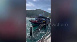 Terrified tourists leap from shaking ferry to pier as storms and choppy seas hit Thailand
