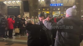 Locals sing and dance as Christmas tree lit up at Kyiv train station