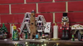 Lego-loving couple build 12ft Lego Christmas wall complete with fireplace