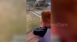 Adorable moment little boy sees snow for the first time