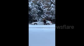 Canada: Car Stuck On Snow Accumulated Road In British Columbia