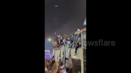Up close footage of Argentina players being welcomed by fans on open-top bus in Buenos Aires