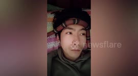 Man with COVID-19 places pet snake on forehead to lower his temperature