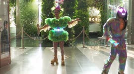 Rollerskaters and light jugglers entertain in Bangkok shopping mall