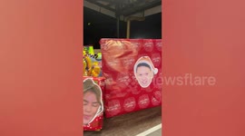 Office workmates print wacky faces for Christmas party gifts instead of name tags