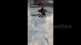Baggage tractor stuck in snow at Vancouver International Airport
