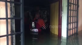 Stranded pensioner rescued from flooded home in Malaysia as thousands are evacuated