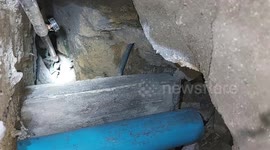 Kind office workers rescue abandoned kitten trapped under drain of building in Thailand