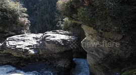 Unique Rushing Water through rock formations feeding waterfall