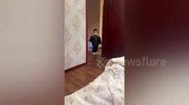 Toddler accompanies mum with COVID-19 by sitting outside her room