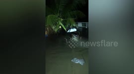 Baby boy rescued in basin from floods in Indonesia